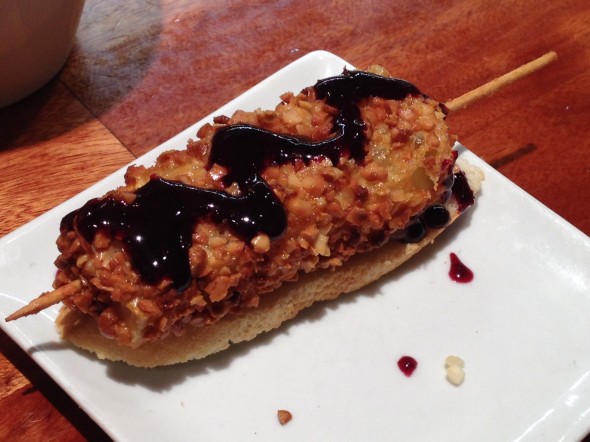 One of my favorites, brie cheese covered in crushed almonds, fried, then topped with a blueberry reduction drizzle.
