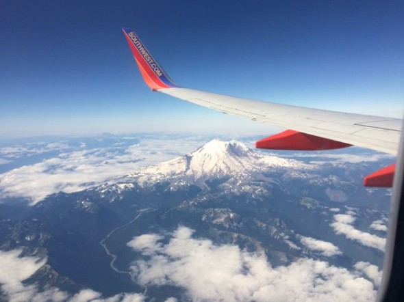 Looking over the wing of our plane approaching northern Washington, home of Mt Rainier