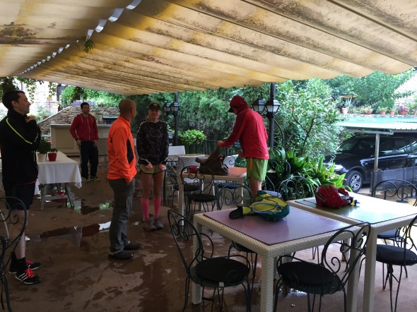 Under the covered patio area, we all ready ourselves to leave in the rain.  After over an hour of trying to wait it out, we were ready to just go!