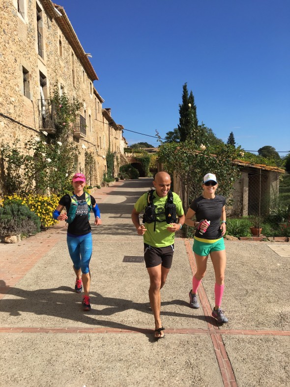 Whitney, Pedro, and Sally running through one of today's small stone towns