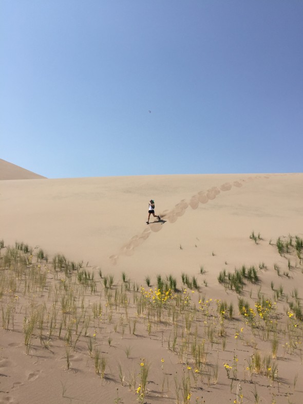 Whit running down a Dune