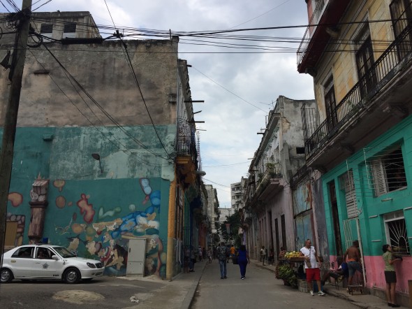 A glance down the street of one of the more run-down neighborhoods.  Even in the more impoverished areas, people seem engaged with each other and there is motion and energy, not absence of life.
