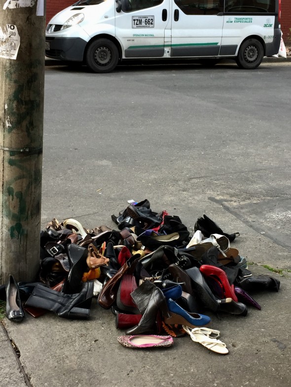 One morning on the way to a class I came upon this random huge pile of women's shoes.  Just speculating, but I like to think it was a group of women that got fed up with the difficulty of walking in these things and just dumped them here on the corner. 