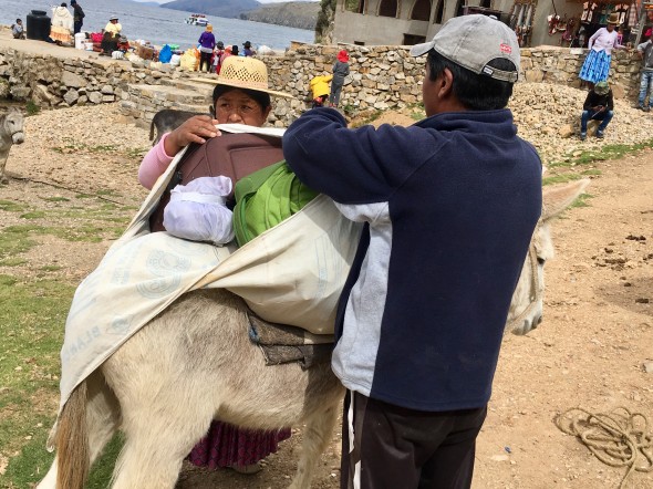 Our lodging owners loading up their donkeys. Most people seem to own at least one donkey because they are a main method of transportation on this small but steep island.